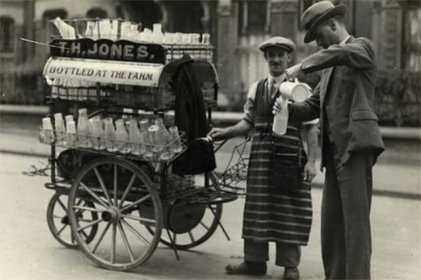 Public Health Inspector taking milk sample from T H Jones Dairyman c1936