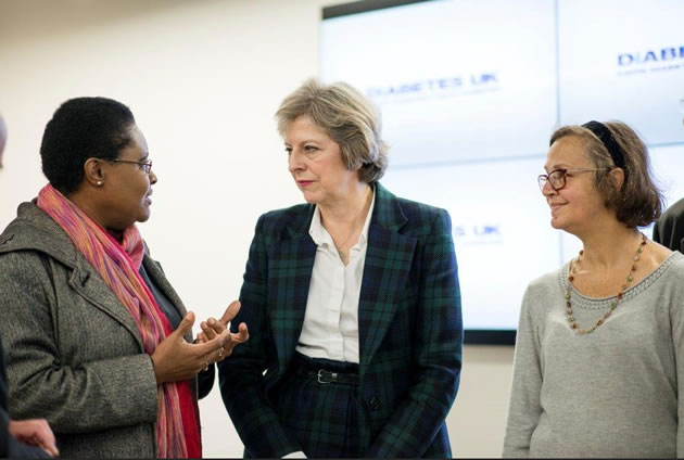 Julia Tyson, right, with Theresa May and a fellow volunteer