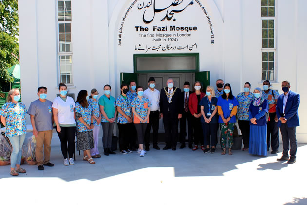 NHS staff with MP and Mayor outside the Fazi Mosque