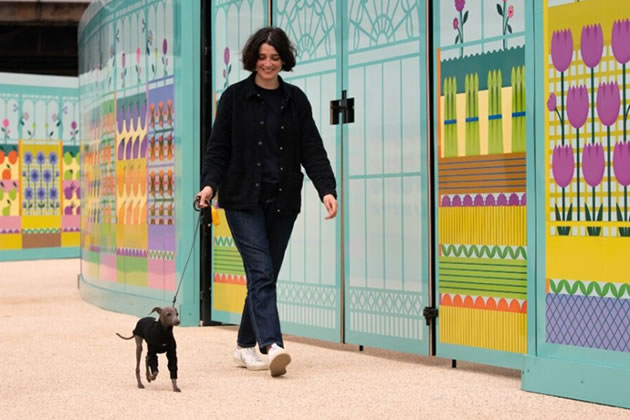 Artist Anna Nicolò and dog on the walkway she designed