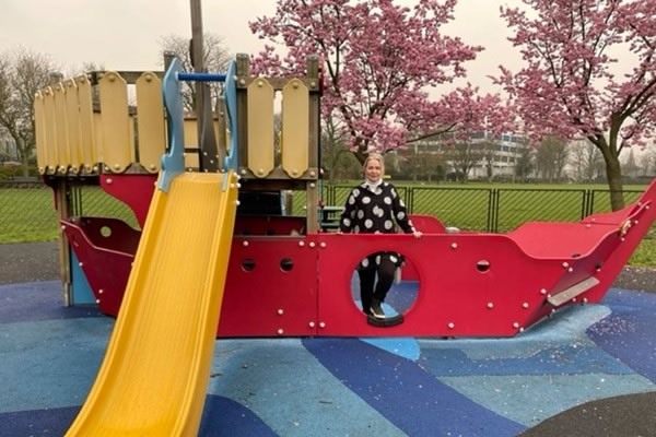 Cllr Steffi Sutters next to the new slide
